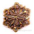 Beaded motifs, made of mesh, pearls and embroidery thread, available in various colors/sizes